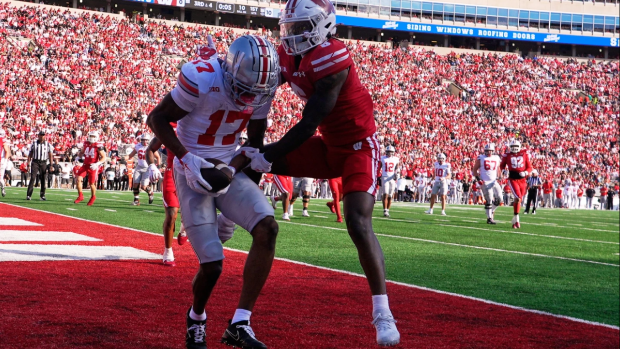 Ohio State's Carnell Tate catches a touchdown pass in front of Wisconsin's Omillio Agard during the first half of an NCAA college football game Saturday, Oct. 18, 2025, in Madison, Wis.