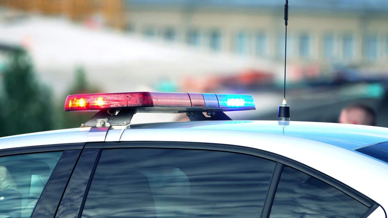 A police cruiser with its lights on.