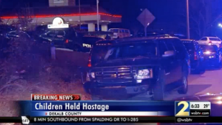 Police vehicles at hostage situation at a Georgia hotel.