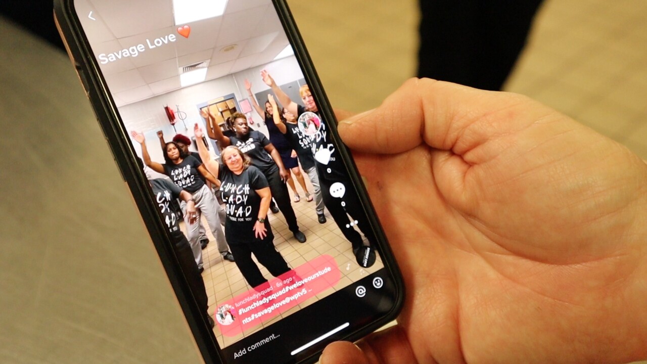 The 'Lunch Lady Squad' at Wellington Landings Middle School records a TikTok video on April 22, 2022 (2).jpg