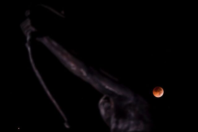 Photos: Lunar eclipse offers thrilling views of 'blood moon' across the world