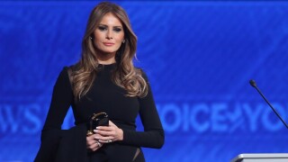 Melania Trump stands on stage.