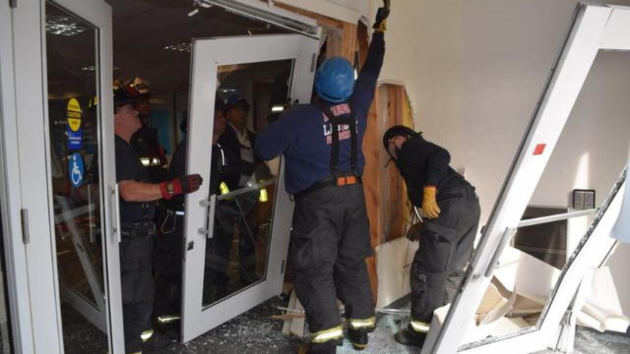 PHOTOS: SUV crashes into bank on Indy's NE side