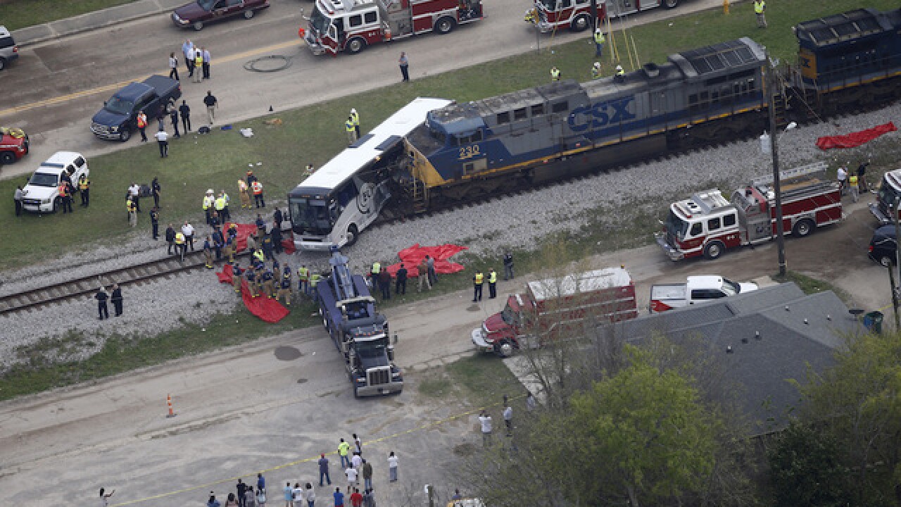 At least 3 dead after train strikes bus in Mississippi