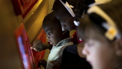 Kids playing on iPads.