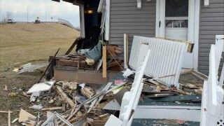 Three people injured after vehicle crashes into Neenah home