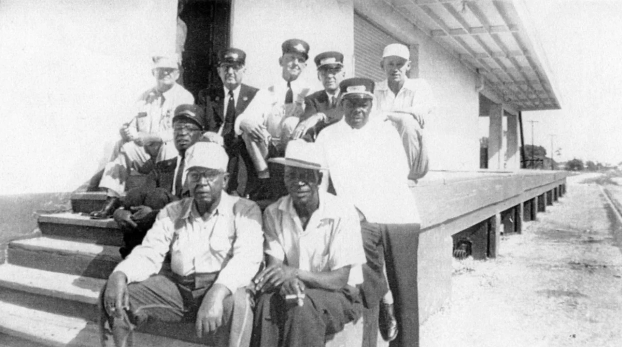 Group shot of railroad employees on the steps of the Naples Depot’s loading dock. Collier County Museums 06.17.60