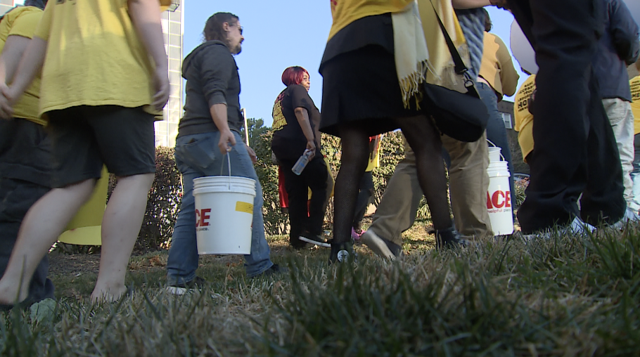 Tenants Marching Buckets of water