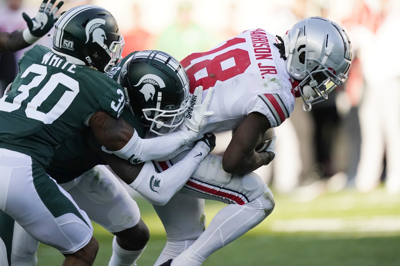 Ohio State Buckeyes receiver Marvin Harrison Jr. pulls Michigan State cornerbacks Justin White and Ameer Speed into end zone for TD, Oct. 8, 2022