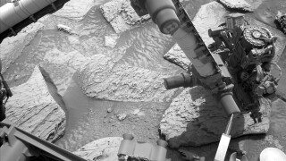 NASA rover shakes off stuck rock.