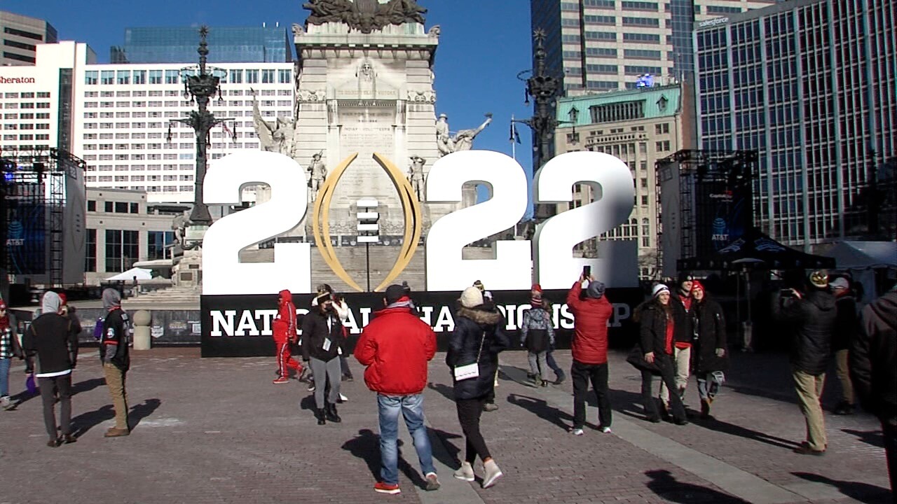 College Football fans brave the cold weather to enjoy the festivities on Monument Circle 
