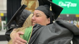 Jodi Belongia and Gretchen Conley share hug