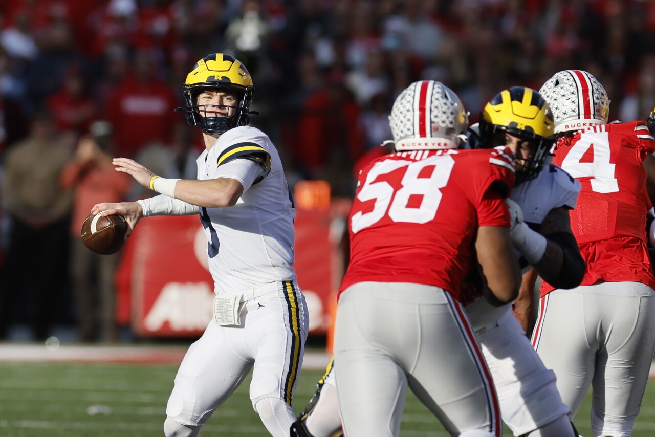 Michigan Wolverines QB JJ McCarthy drops back to pass at Ohio State Buckeyes, Nov. 26, 2022
