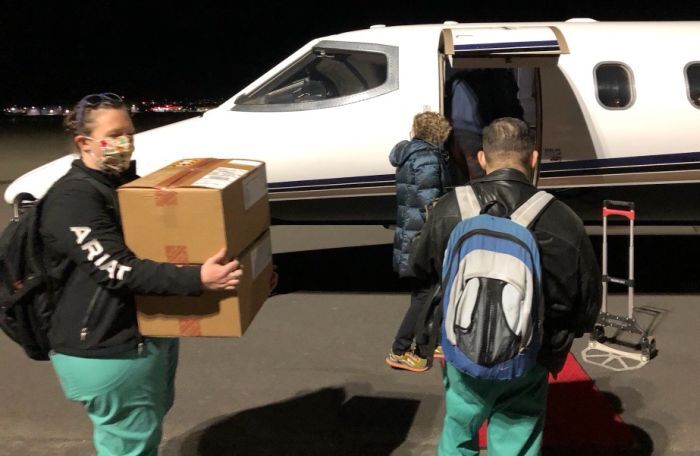 MTVAHCS staff loading the plane