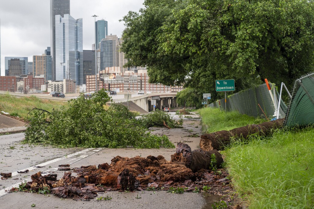 Debris fills the feeder road near Interstate 10 and Interstate 45 near downtown Houston after severe storms passed through the area.