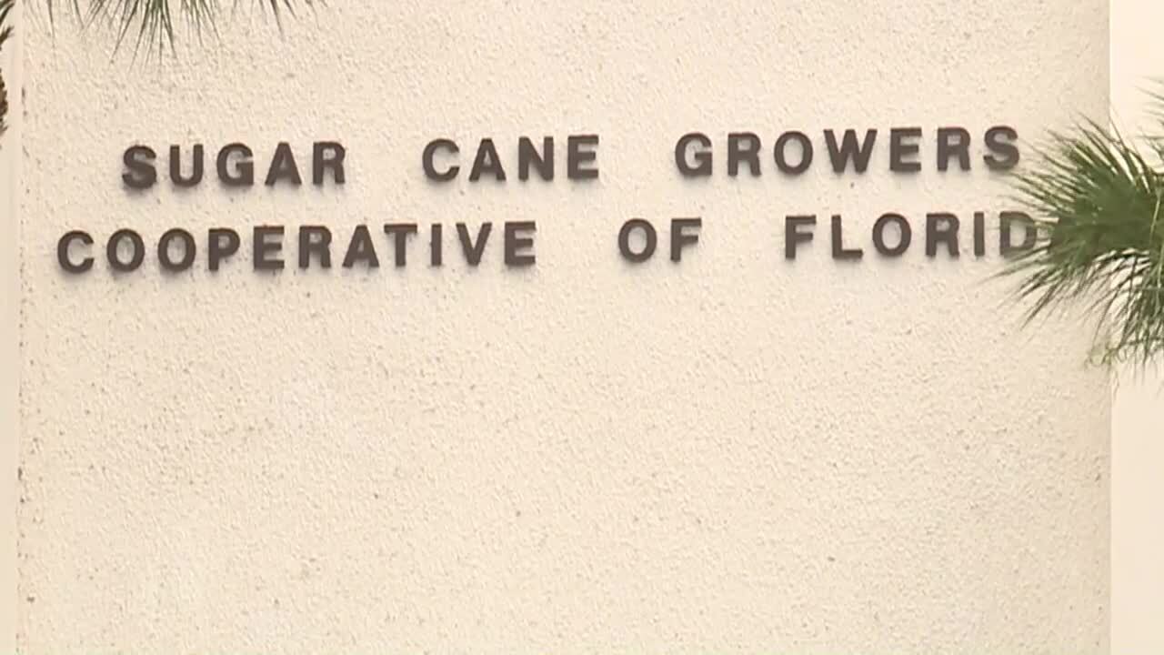 Sugar Cane Growers Cooperative of Florida sign outside building where shooting took place, June 4, 2021