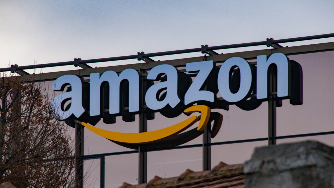 An Amazon logo on the side of a building.