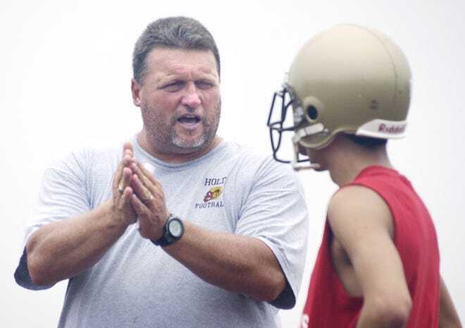 Coach Mike Smith talking to a player