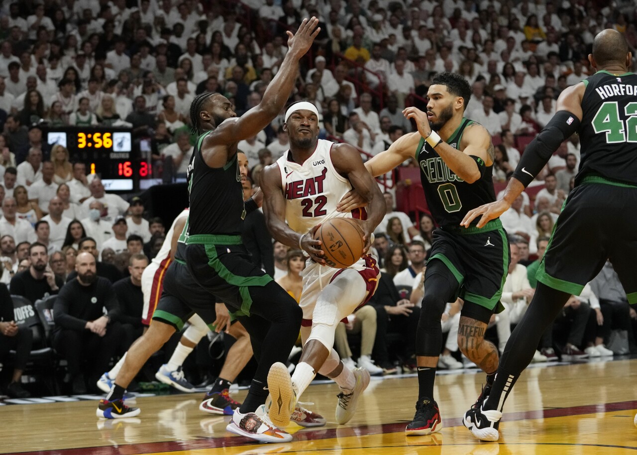 Boston Celtics forward Jayson Tatum and guard Jaylen Brown defend Miami Heat forward Jimmy Butler during Game 3 of NBA Eastern Conference finals, May 21, 2023