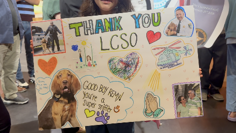 Coutinho's family made signs for K9 Remy