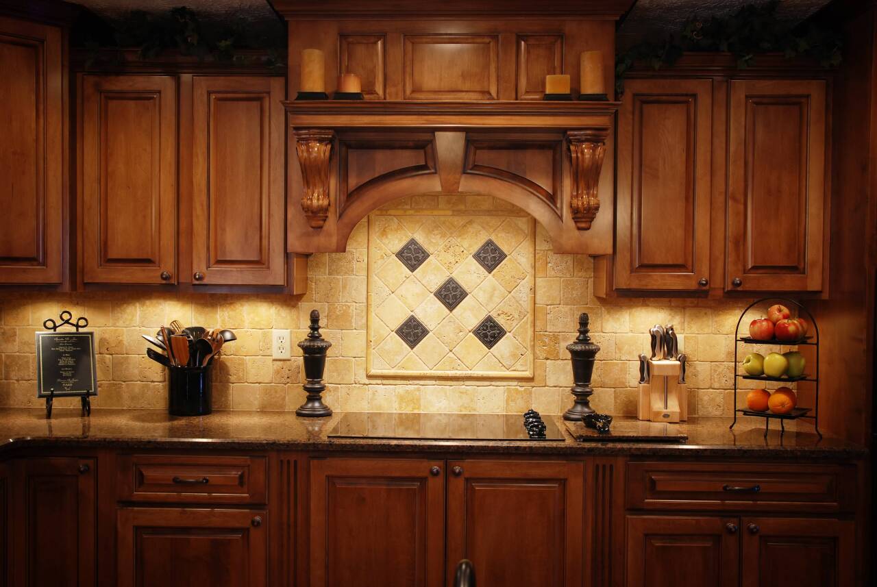 A newly refinished set of kitchen cabinets decorated for the fall season.
