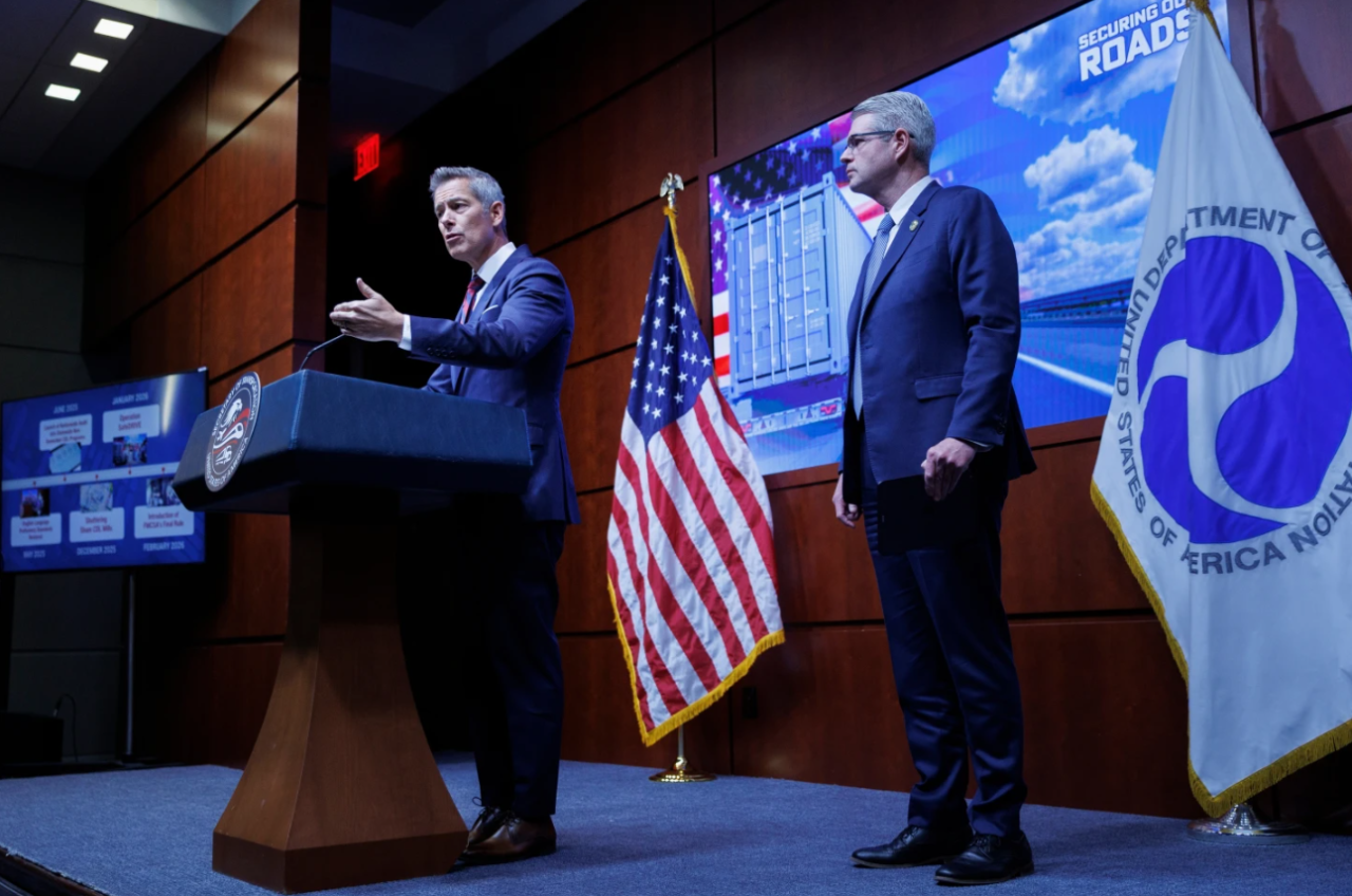 U.S. Department of Transportation Secretary Sean Duffy speaks beside Federal Motor Carrier Safety Administrator Derek Barrs during a news conference on enhancing truck driving safety at the U.S. Department of Transportation on Friday, Feb. 20, 2026, in Washington.