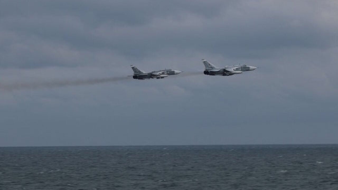 Russian fighter jets 'buzz' US warship in Black Sea, photos show