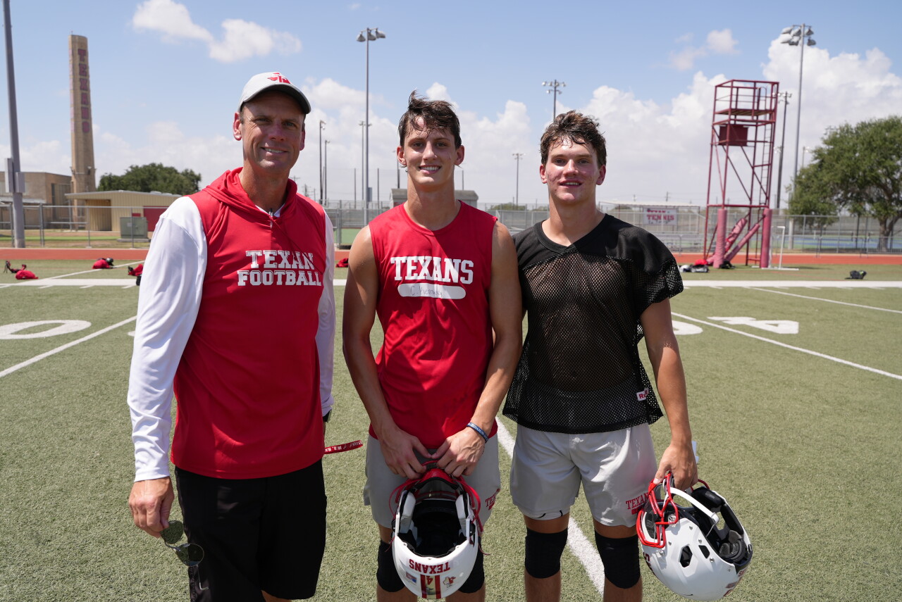 Ray head coach Brian Herman with Cuatro Kennedy and Tripp Thompson