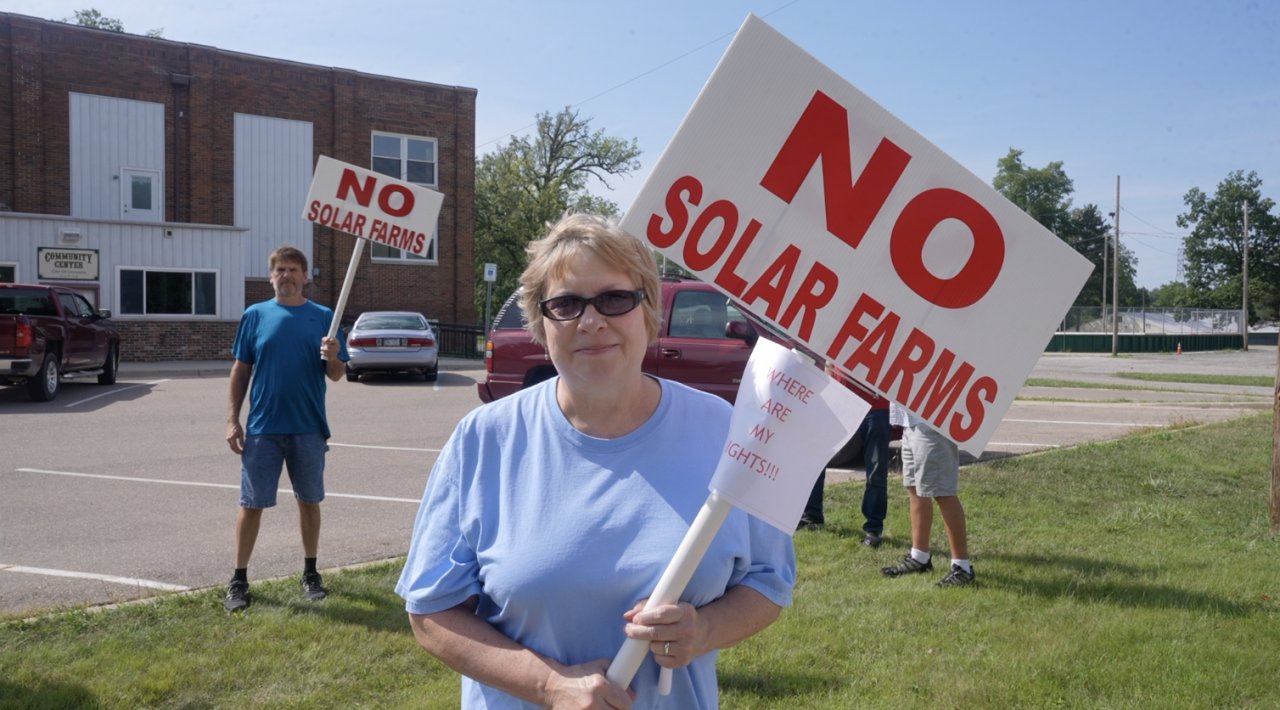 Tammy Dasen with her "NO SOLAR FARMS" sign