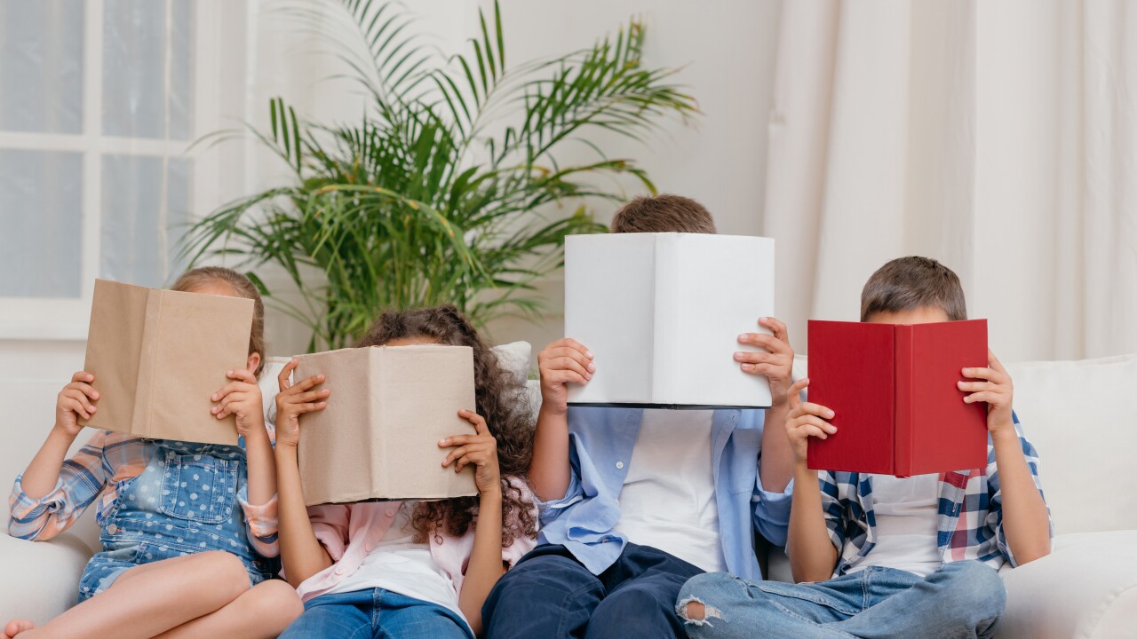 Obscured,View,Of,Children,Covering,Faces,With,Books,While,Reading