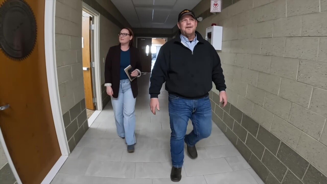 News 5 reporter Michelle Jarboe and Chuck Brooky, president of the North Central Ohio Building & Construction Trades Council, walk through a union hall in Amherst.