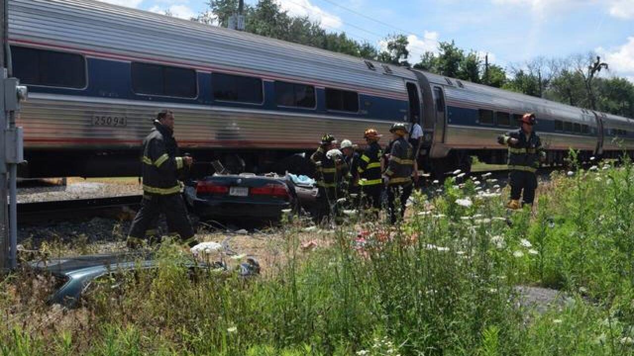 Woman rescued after car hit by train last July