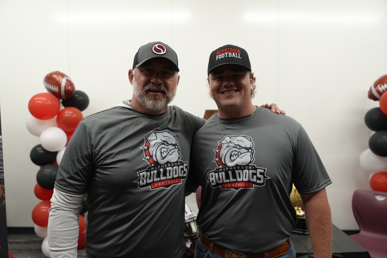 Sinton football head coach Michael Troutman with Zack Busack