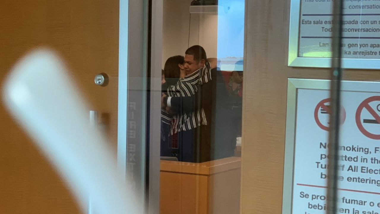 HUGGING IN COURT.png