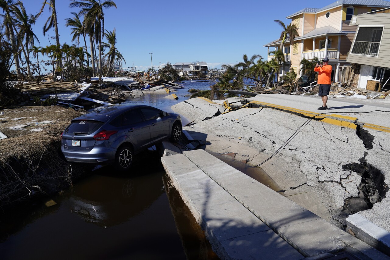 Man takes photo of destruction around bridge leading to Pine Island after Hurricane Ian, Oct. 2, 2022