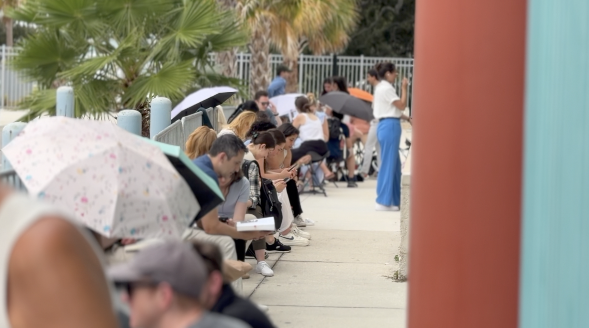 Community members line up outside the Council meeting Thursday night