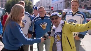 WPTV anchor Meghan McRoberts speaks to Finland hockey fans in Milan on Feb. 10, 2026.