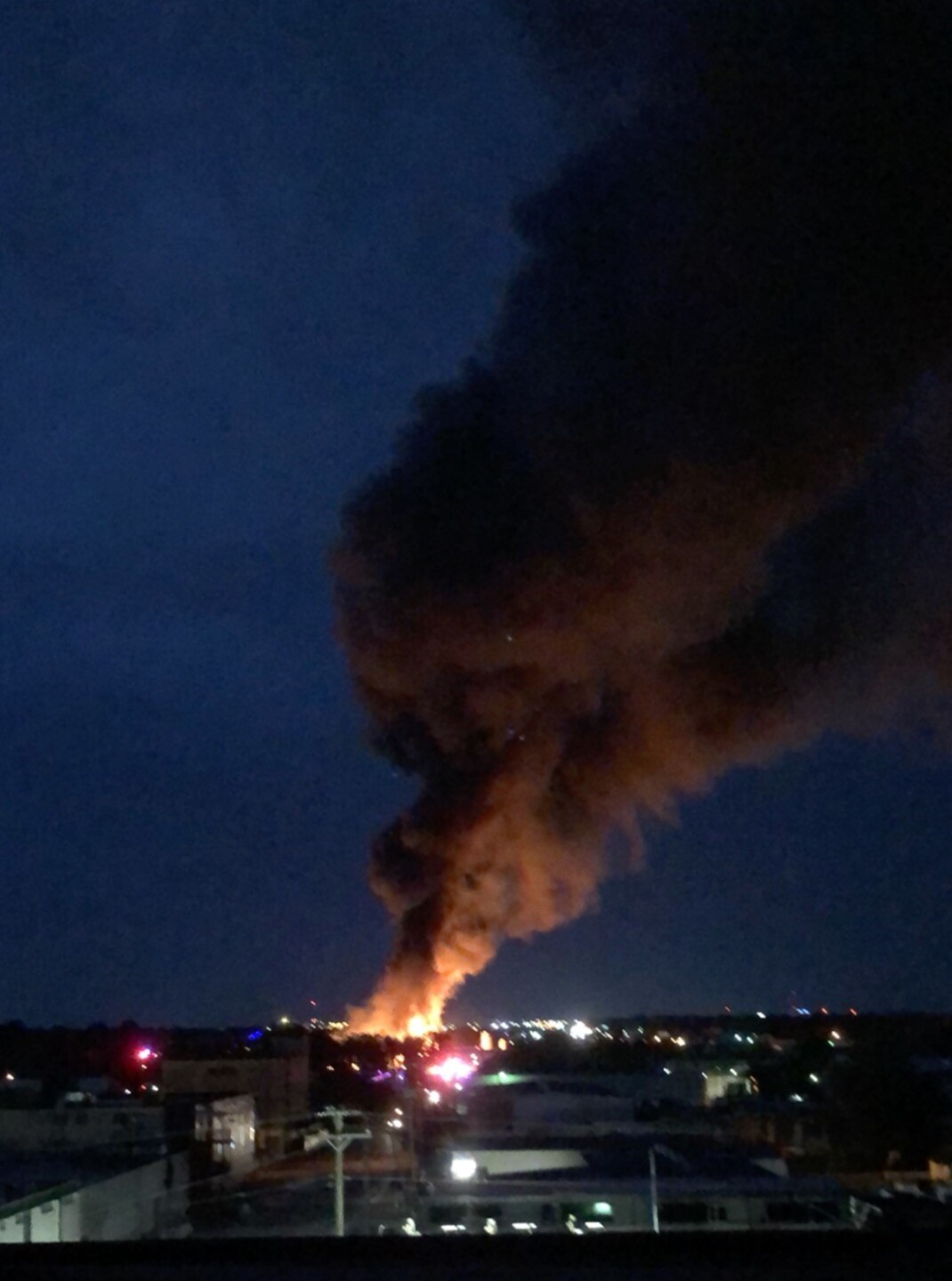 Fire and large smoke plumes seen from distance as old Langford Distribution building burned to the ground, Photo by: Jordan Leist