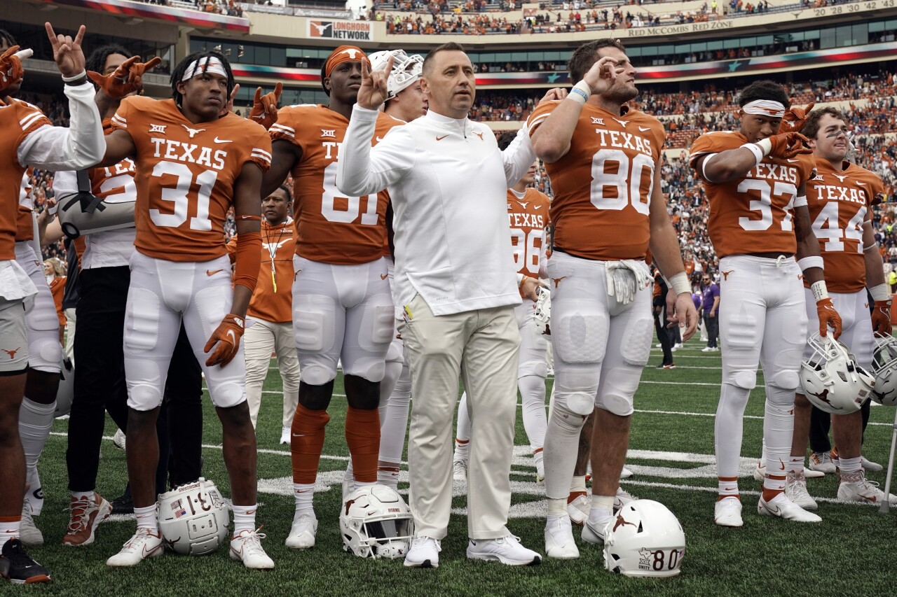 Texas Longhorns head coach Steve Sarkisian and players sing 'Eyes of Texas' after defeating Kansas State Wildcats, Nov. 26, 2021