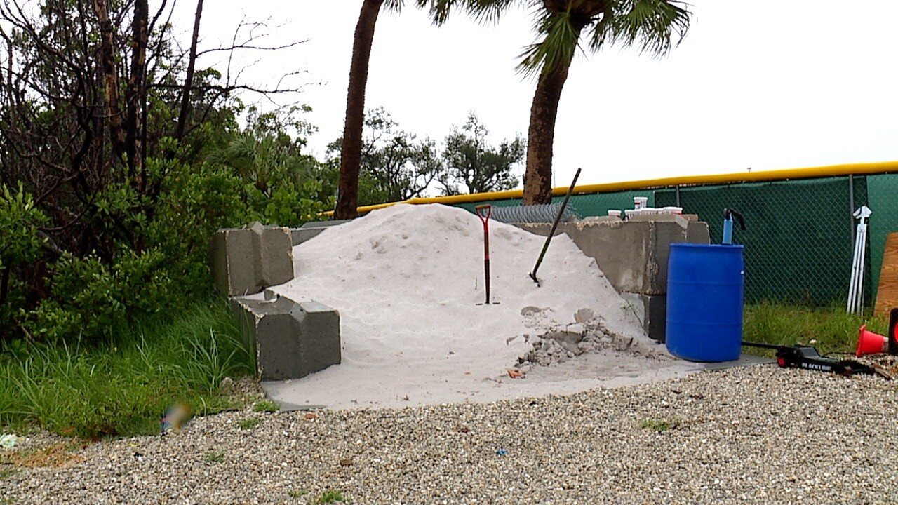 Massive sand pile for people to fill their sandbags from near Fort Myers Beach Town Hall.