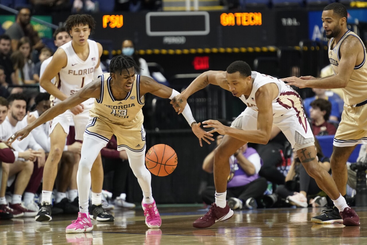 Florida State Seminoles forward Baba Miller foulded by Georgia Tech Yellow Jackets guard Miles Kelly in 2023 ACC Tournament