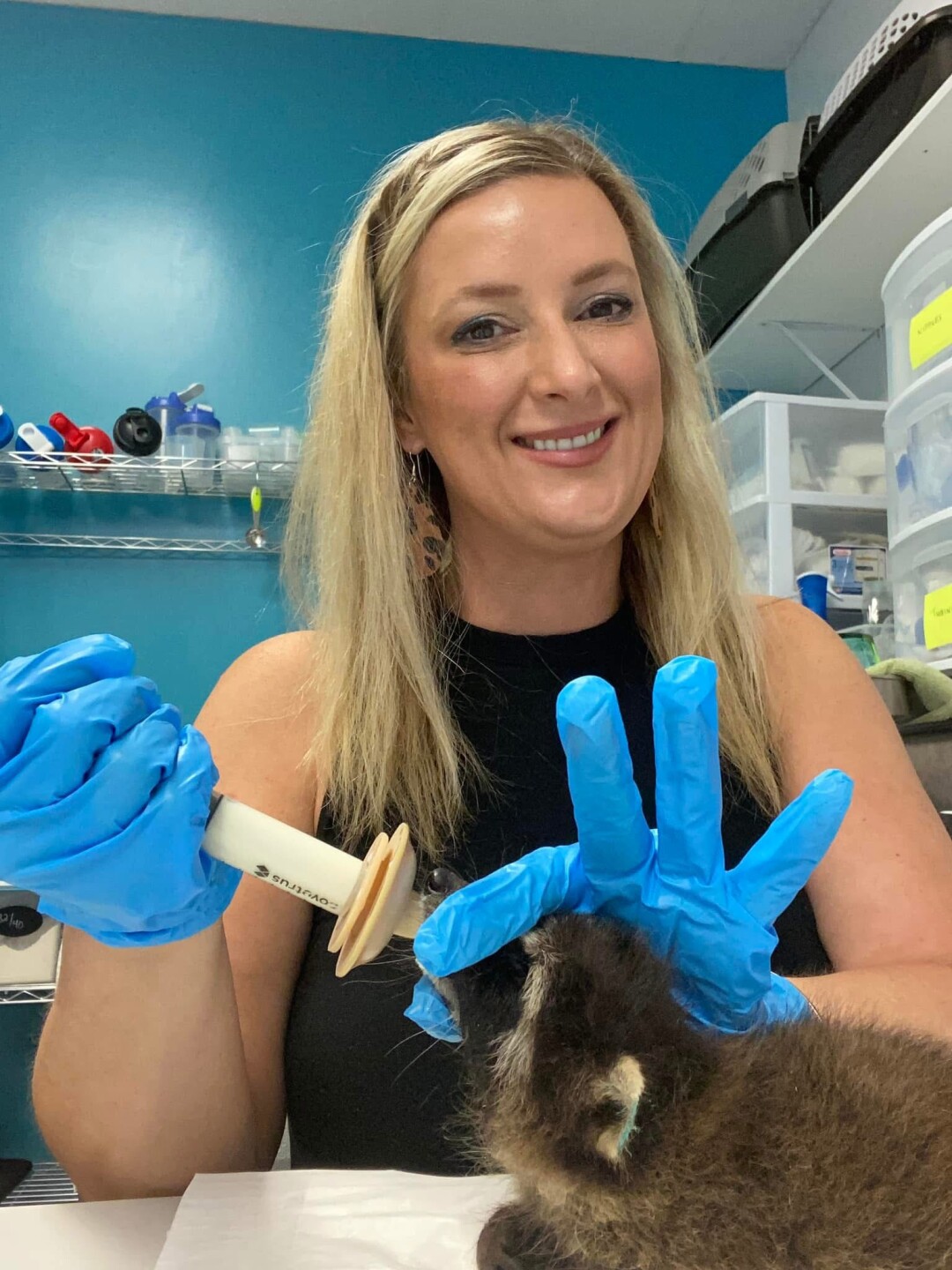 feeding a raccoon.jpeg