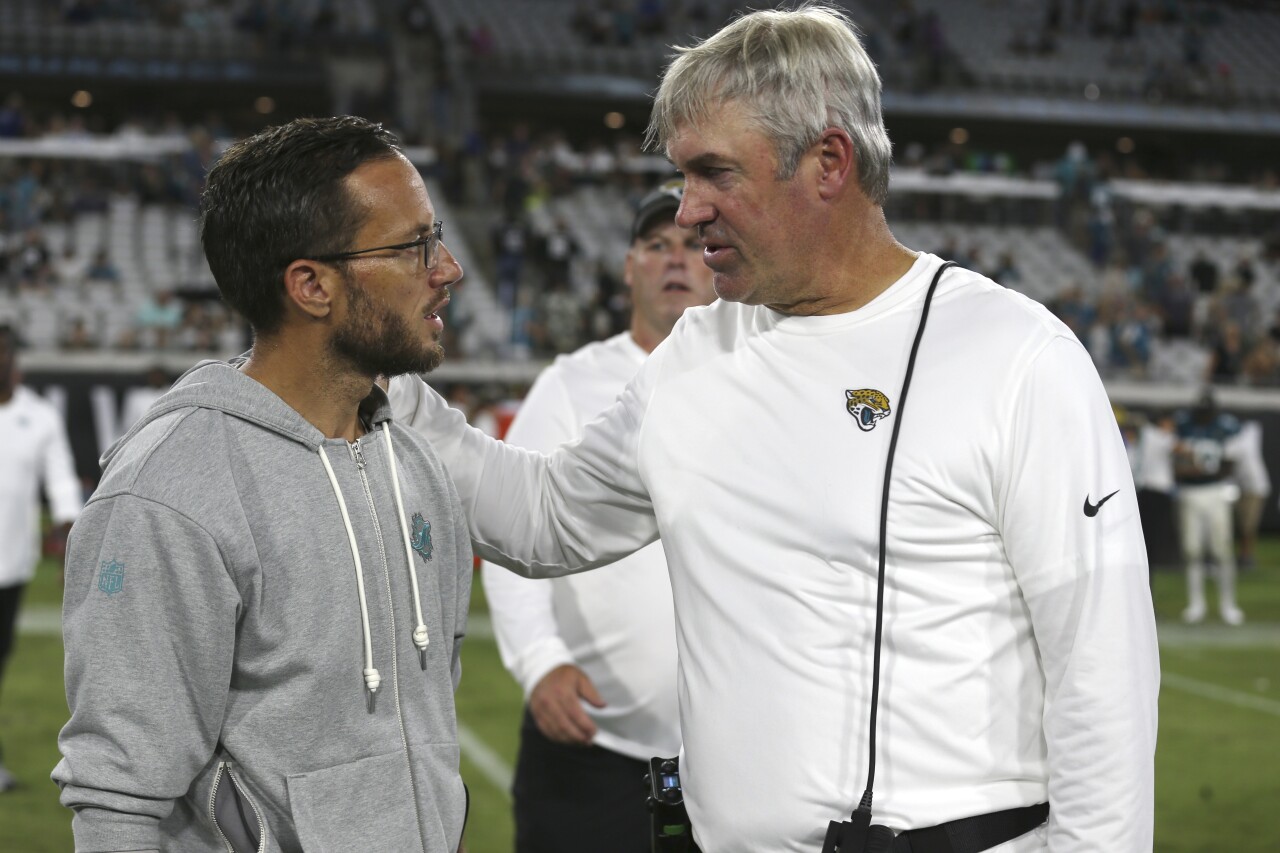 Miami Dolphins head coach Mike McDaniel and Jacksonville Jaguars head coach Doug Pederson speak after injury to Dolphins receiver Daewood Davis in preseason game, Aug. 26, 2023