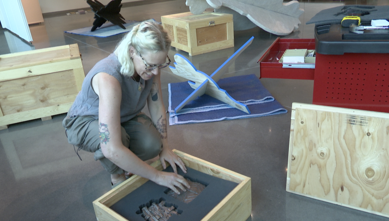 Erica Hess sets up gallery