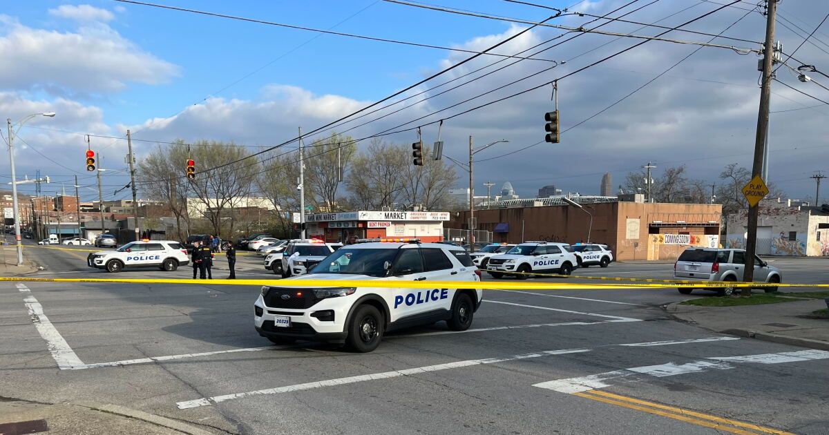 1 hospitalized, 1 in custody after shooting in West End
