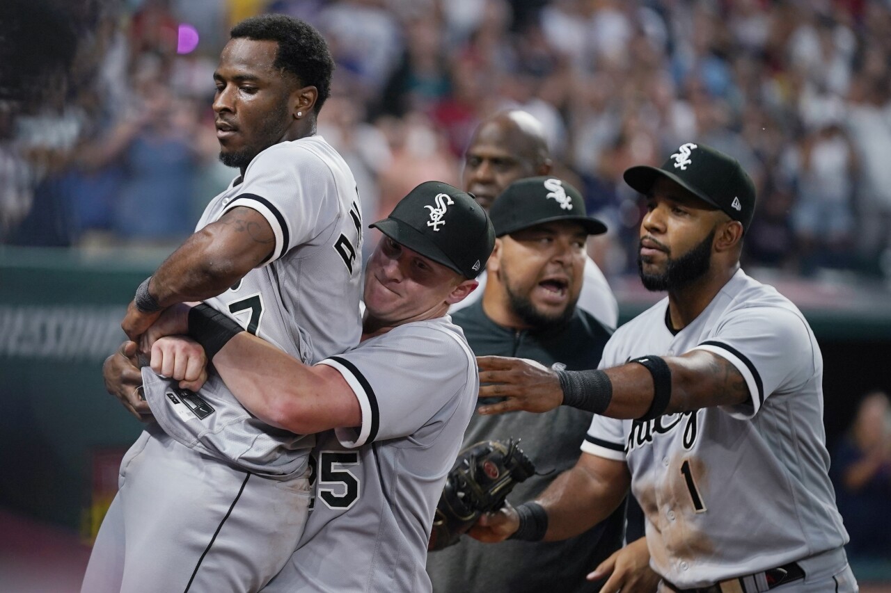 Chicago White Sox shortstop Tim Anderson held by first baseman Andrew Vaughn after fight with Cleveland Guardians third baseman Jose Ramirez, Aug. 5, 2023