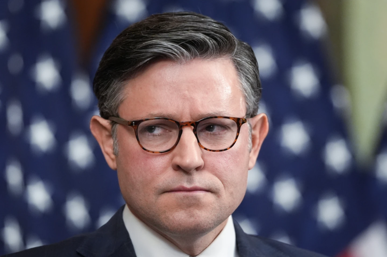 Speaker of the House Mike Johnson, R-La., listens to other GOP leaders as a government shutdown begins its tenth day in Washington, Friday, Oct. 10, 2025.