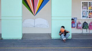 A student takes a break from soccer during recess at Perkins K-8 School Thursday, Nov. 13, 2025, in San Diego. (AP Photo/Gregory Bull)