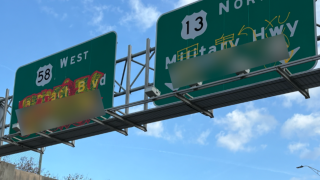Signs on Military Highway in Norfolk tagged with graffiti