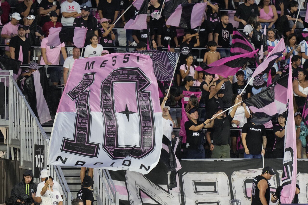 Inter Miami fans wave flags for Lionel Messi, July 16, 2023